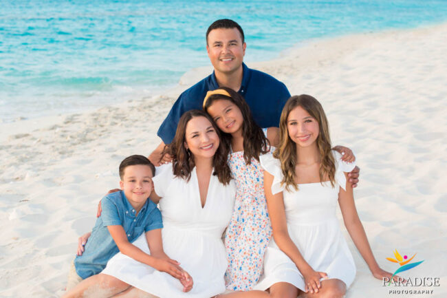 beach family portrait sitting in sand