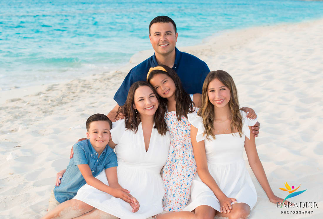 beach family portrait sitting in sand
