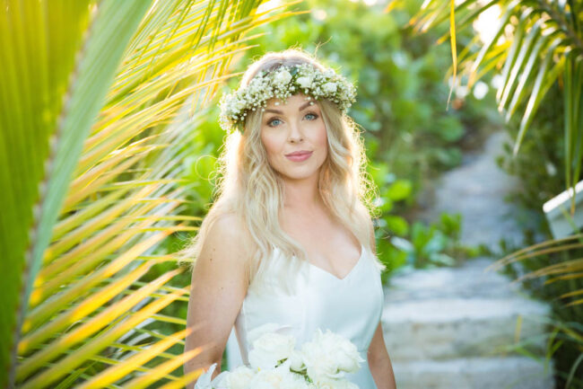 06-sapodilla-bay-wedding-turks-and-caicos bride with green palms