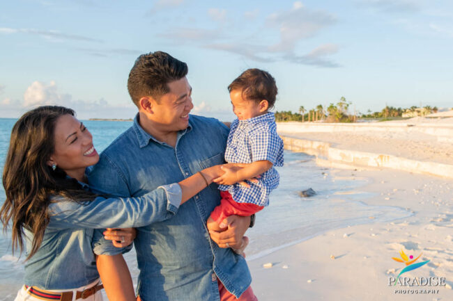 05 Secluded Beach Family Portrait mom and dad with son on the beach