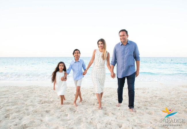 holding hands walking up the beach