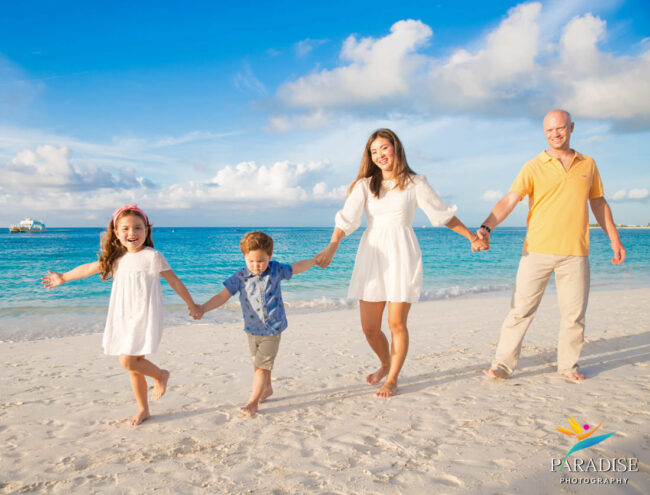 014_Paradise_Photography_Seven_Stars_portraits_ holding hands walking along grace bay beach