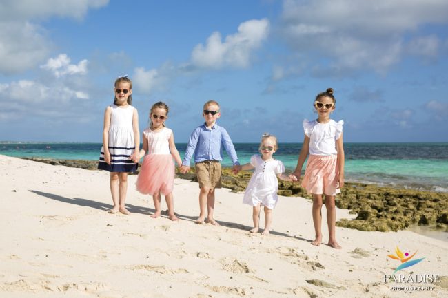 01 Villa Paprika Family Photos kids walking along the beach