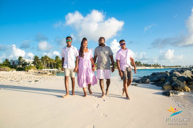 001 Family Photos in Turks and Caicos candid family walking along the beach