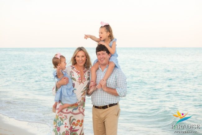 family-smiling-south-bank-shore Happy family smiling by the water’s edge at South Bank Resort
