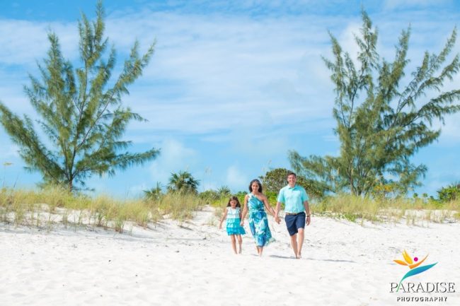 family-walking-sand-dunes Family walking in sand dunes