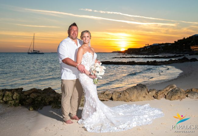 Bride and Groom from behind, sunset beach.