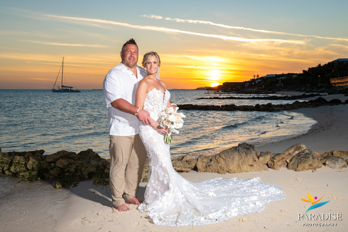 Bride and Groom from behind, sunset beach.