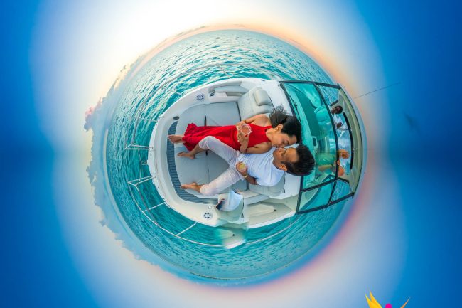 Tiny planet couple boat photo