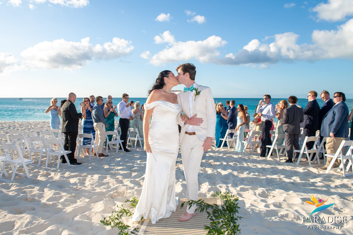 Newlyweds share first kiss during beach ceremony at Ritz-Carlton Turks and Caicos wedding