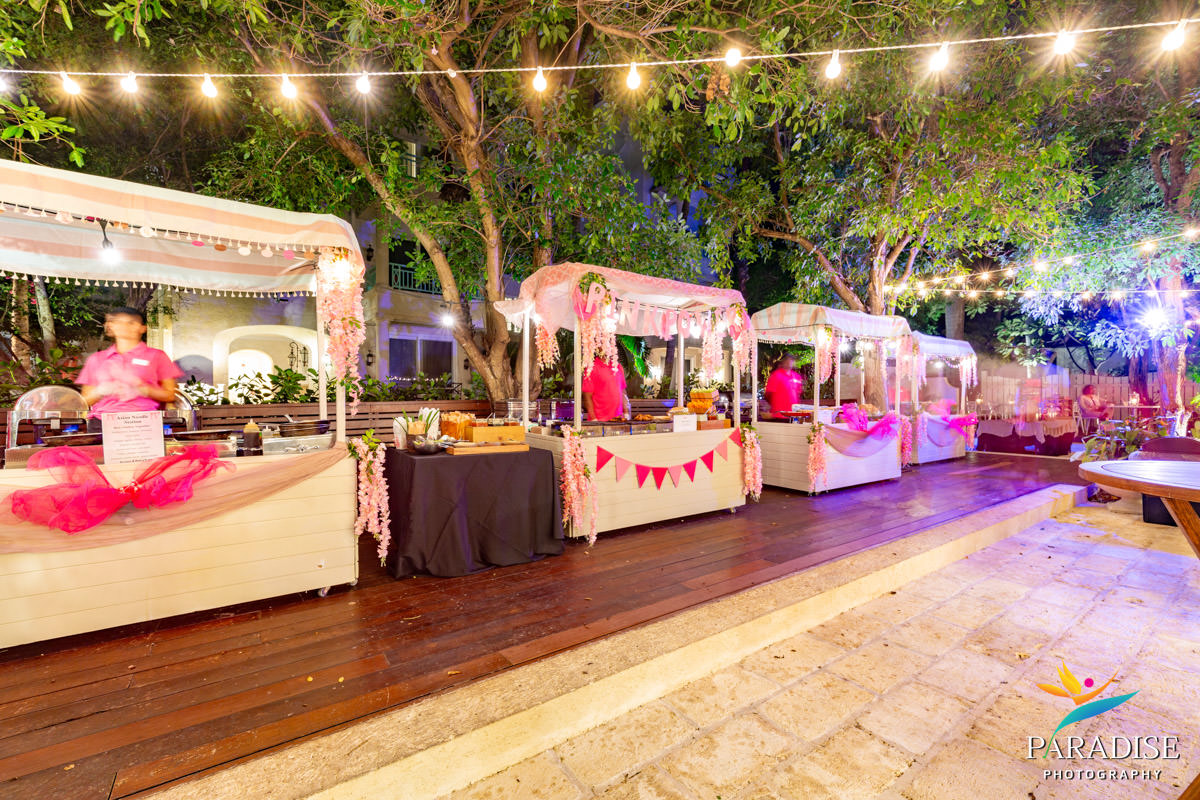 Turks and Caicos event photographer food stations pink canopies string lights