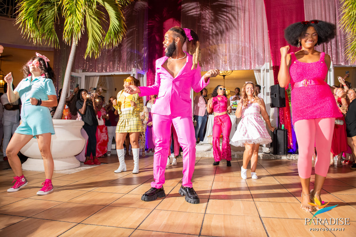Turks and Caicos event photographer guests dancing pink outfits dance floor