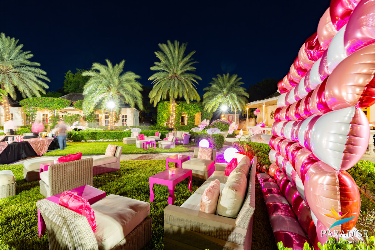 Turks and Caicos event photographer pink lounge seating balloon wall